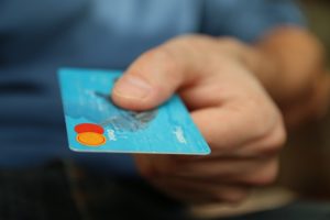 Man with credit card in hand