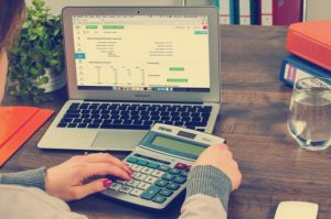 Woman using calculator