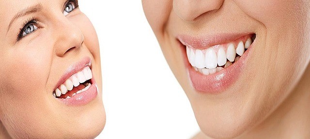 Woman focused on teeth cosmetic dentistry health insurance