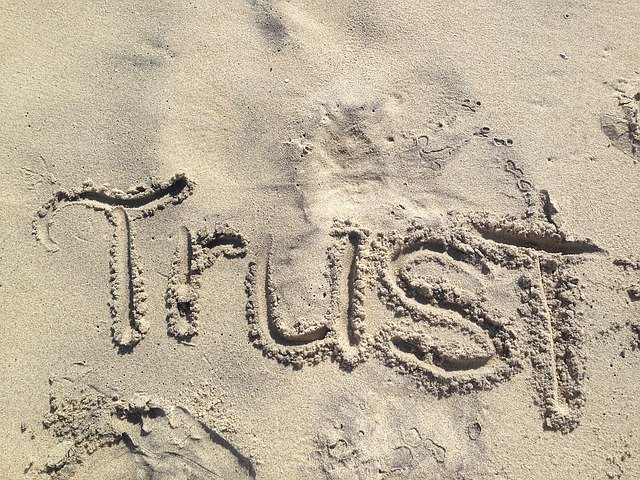 Florence Health Insurance Agent Trust written in sand
