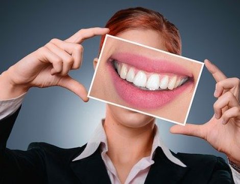 dental insurance Woman showing teeth